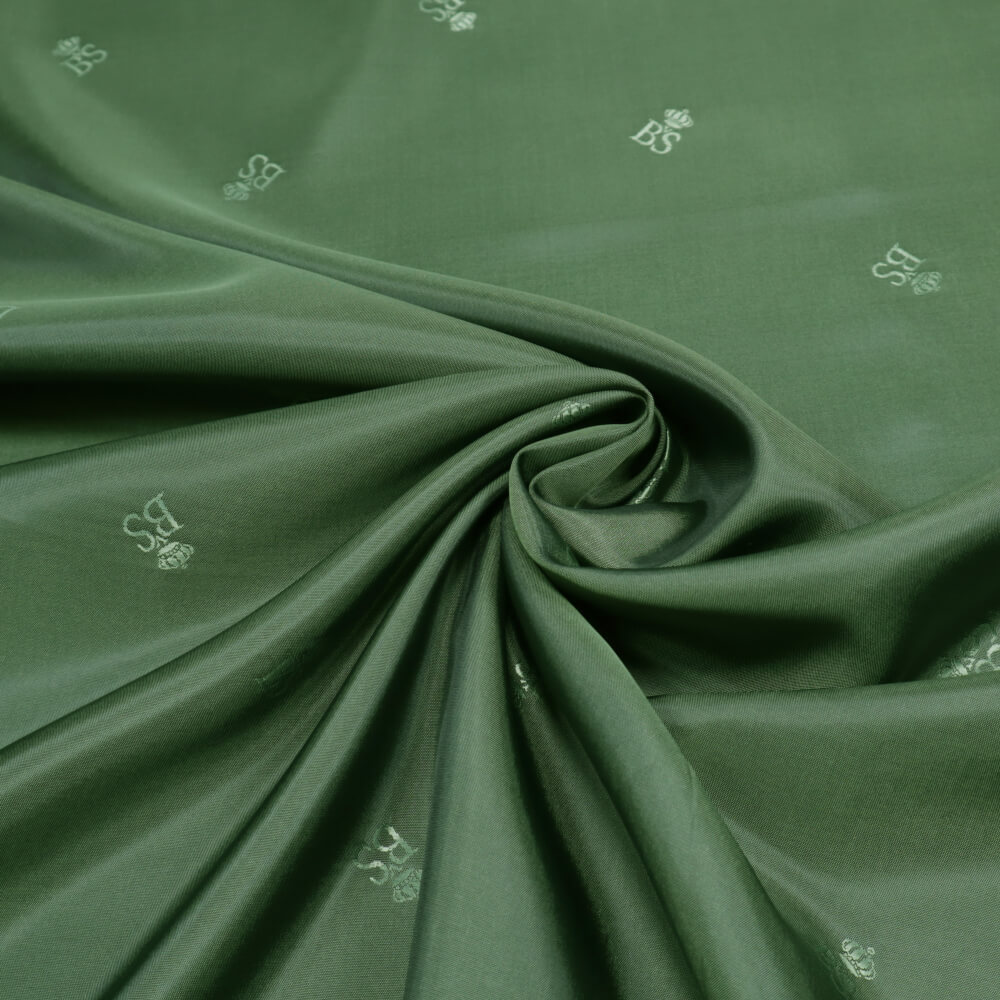0,5m | Futterstoff 140cm Breit aus 100% Polyester Logo-Muster & Changierend - grün/schwarz  (10456)